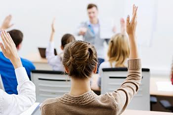 Safety training class - hands raised